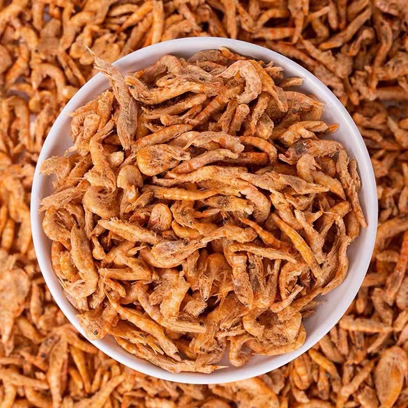 Close-up of freeze-dried baby shrimp dog treats showing natural texture