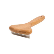 Side view of bamboo dog deshedding brush showing cushioned handle and stainless steel blade