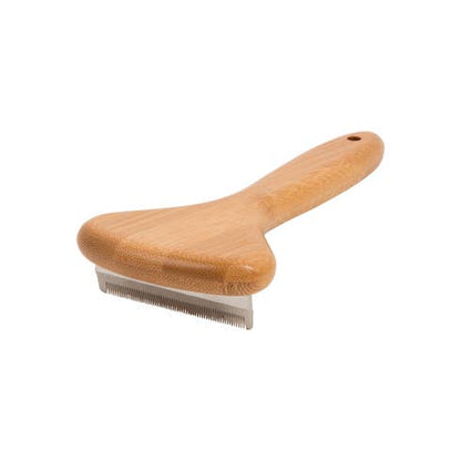 Side view of bamboo dog deshedding brush showing cushioned handle and stainless steel blade