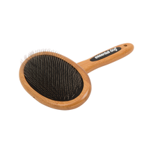 Bamboo dog grooming brush with natural bristles designed for everyday coat brushing