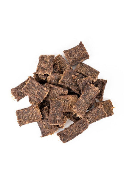 Pieces of grain-free bison jerky dog treats made with just three ingredients