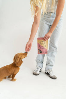 Dog being rewarded with a single-ingredient bison liver treat