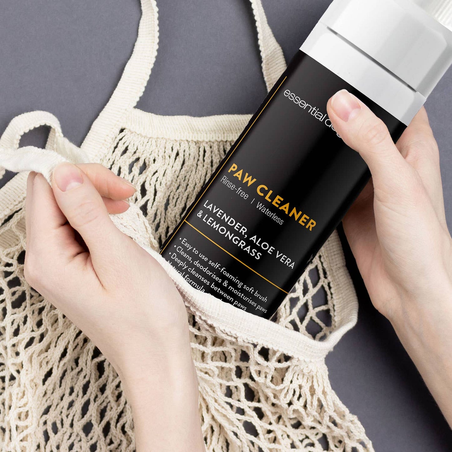 Essential Dog non-toxic paw cleaner being used for easy, gentle paw cleaning at home or on the go