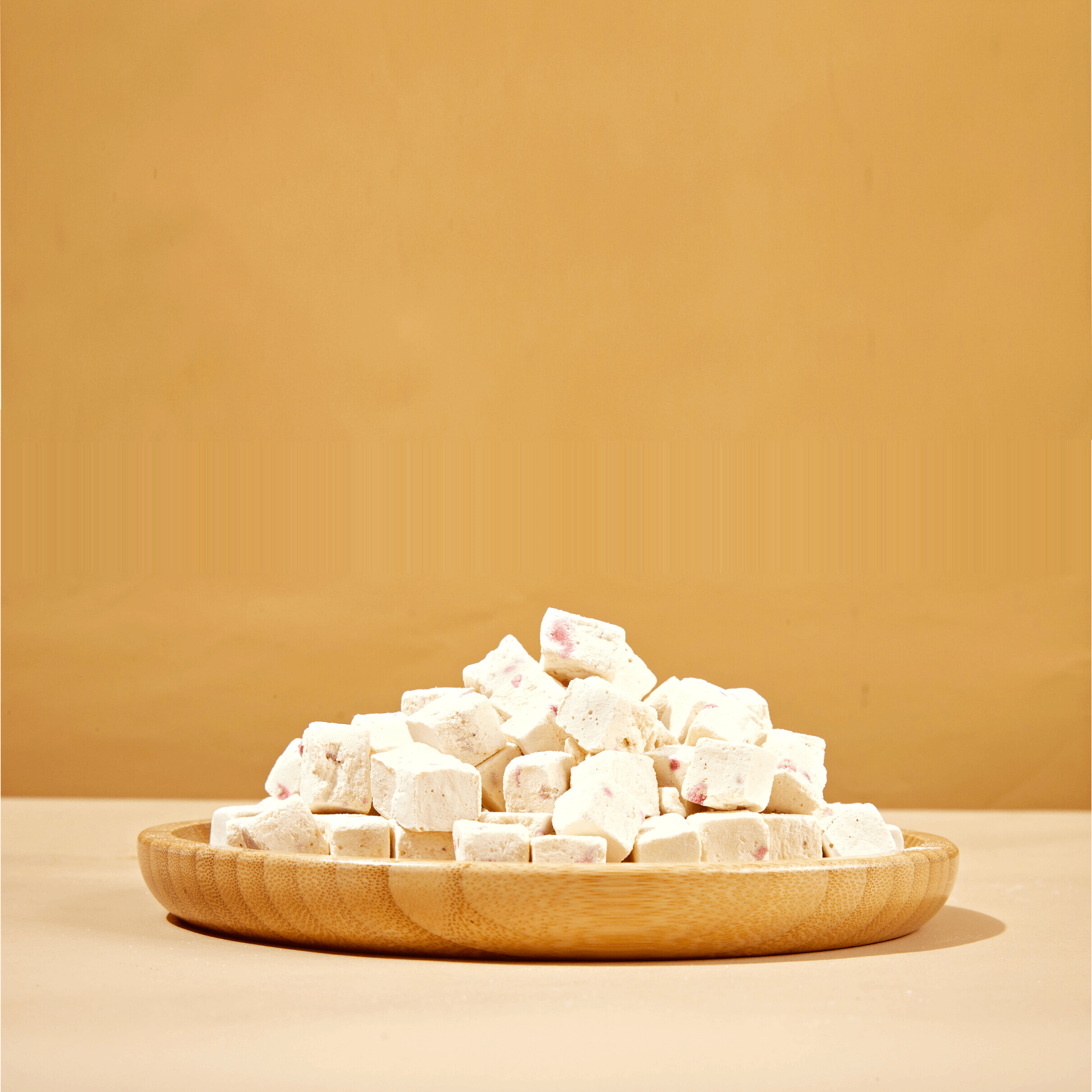 Freeze-dried strawberry yogurt treats for dogs showing bite-size pieces
