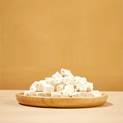 Freeze-dried strawberry yogurt treats for dogs showing bite-size pieces