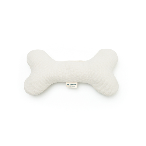 Natural hemp dog bone toy with 100% organic cotton filling for soft, gentle play