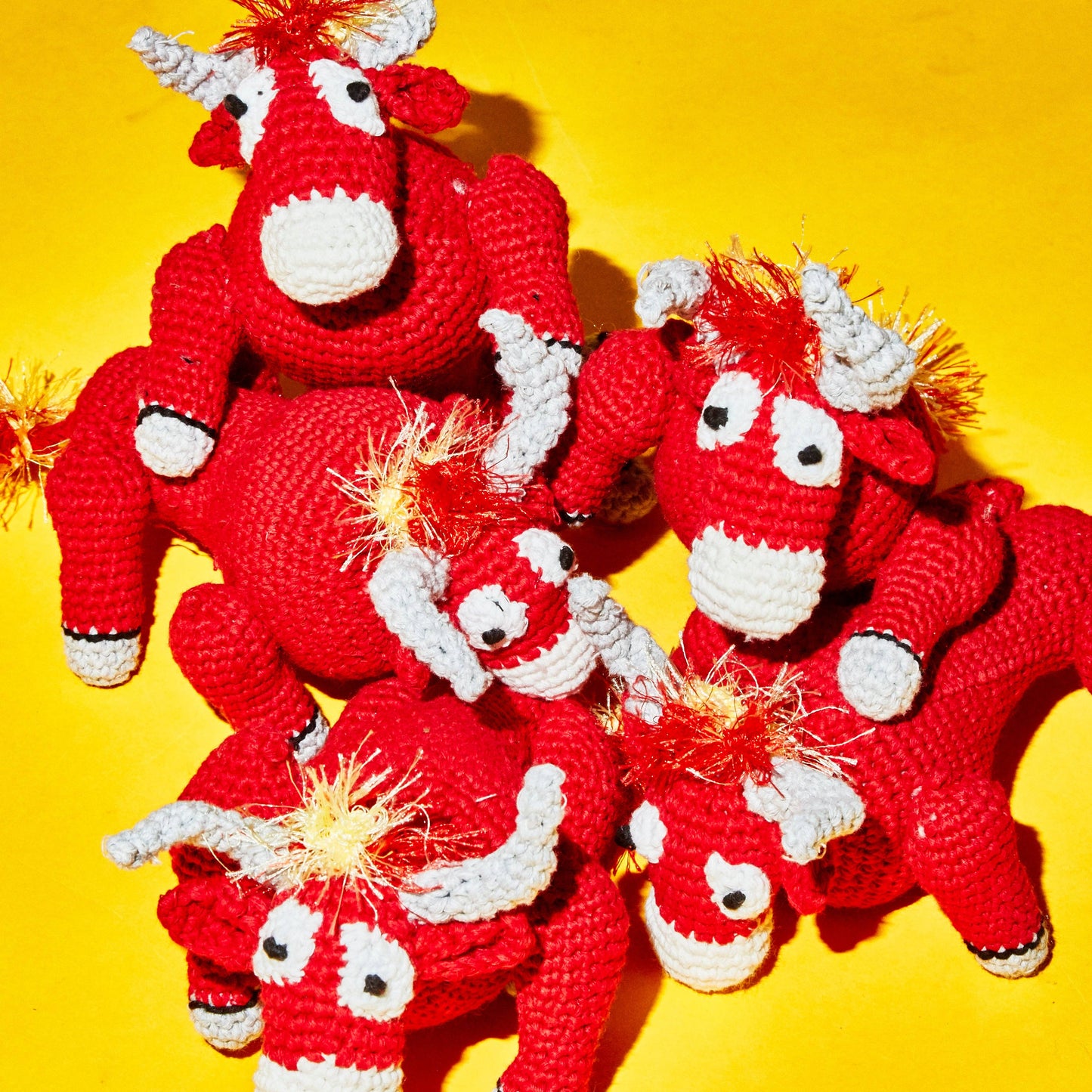 Multiple organic cotton bull dog toys made with all-natural dyes, ethically made and non-toxic