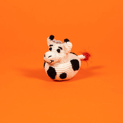 Organic cotton cow dog toy made with all-natural dyes and a built-in squeaker, non-toxic and eco-friendly