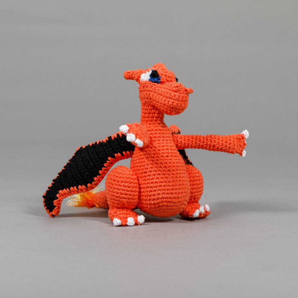 Orange dragon dog toy made from organic cotton and colored with all natural dyes, designed for safer everyday play.
