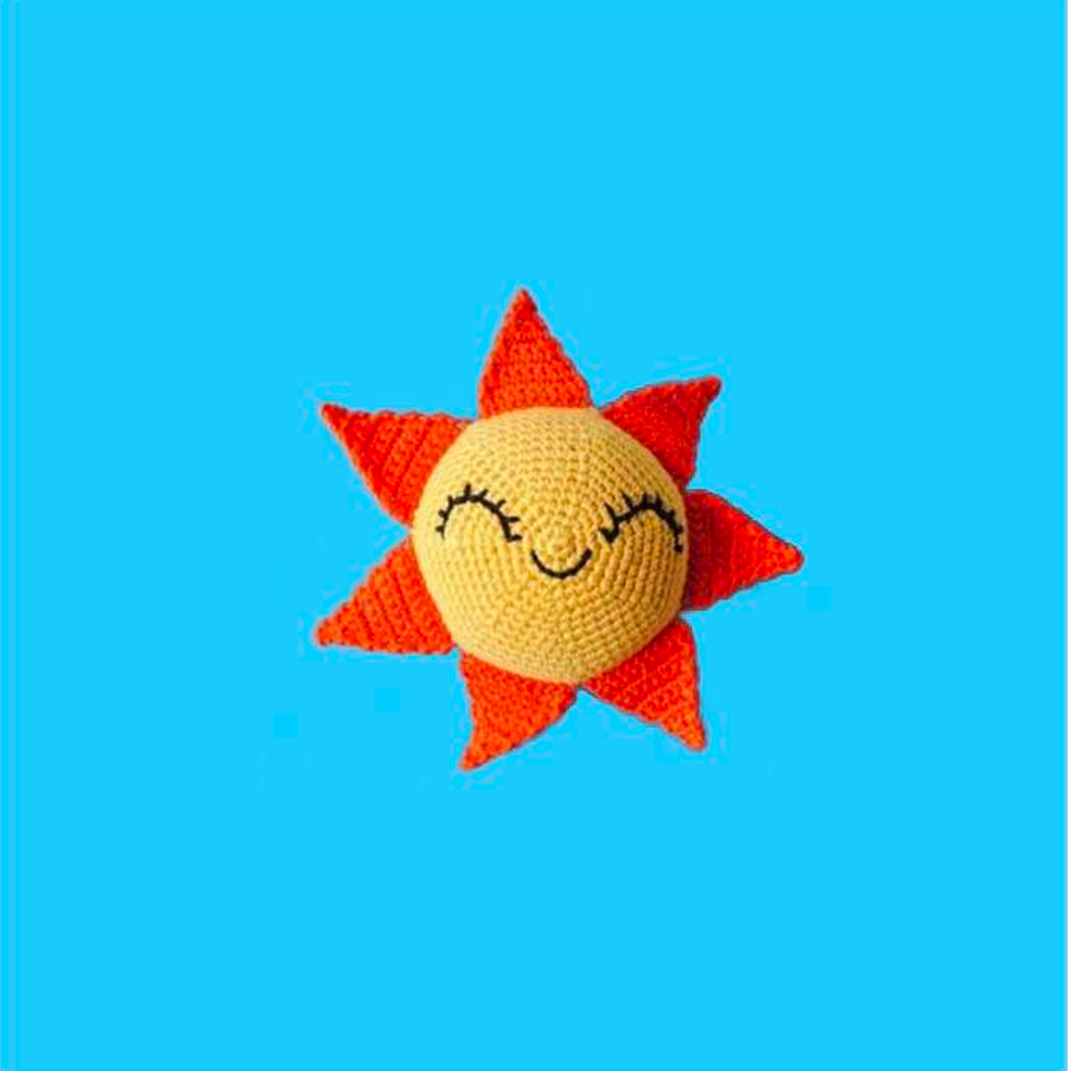 Organic cotton sun dog toy made with all-natural dyes and a built-in squeaker for non-toxic everyday play