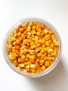 Close-up of freeze-dried pumpkin dog treats showing natural texture and color