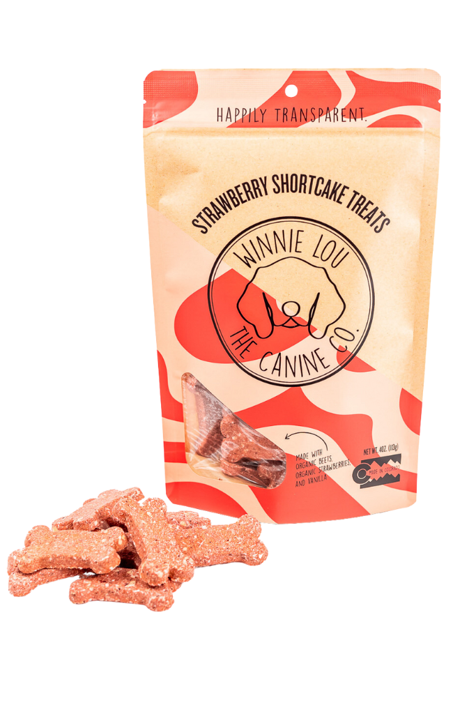 Winnie Lou’s Organic Strawberry Shortcake dog biscuits with pink crunchy treats displayed beside the package