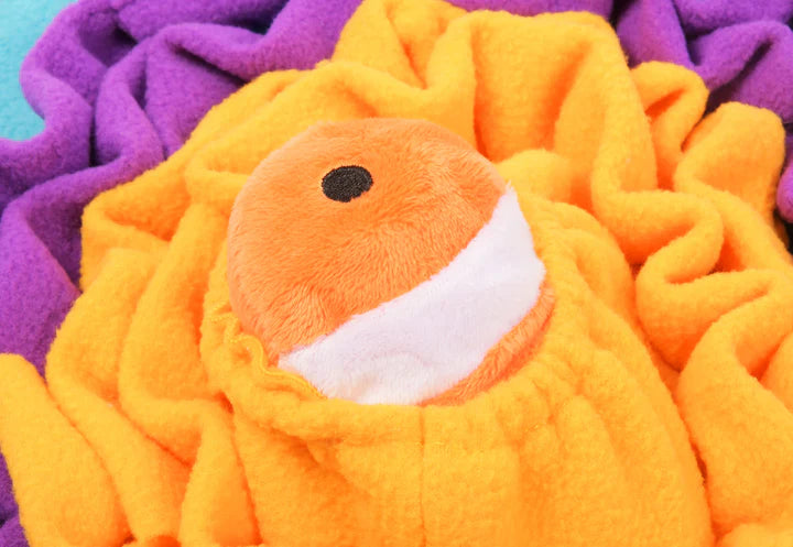 Folded snuffle mat showing soft fabric layers designed for dog enrichment and interactive feeding.