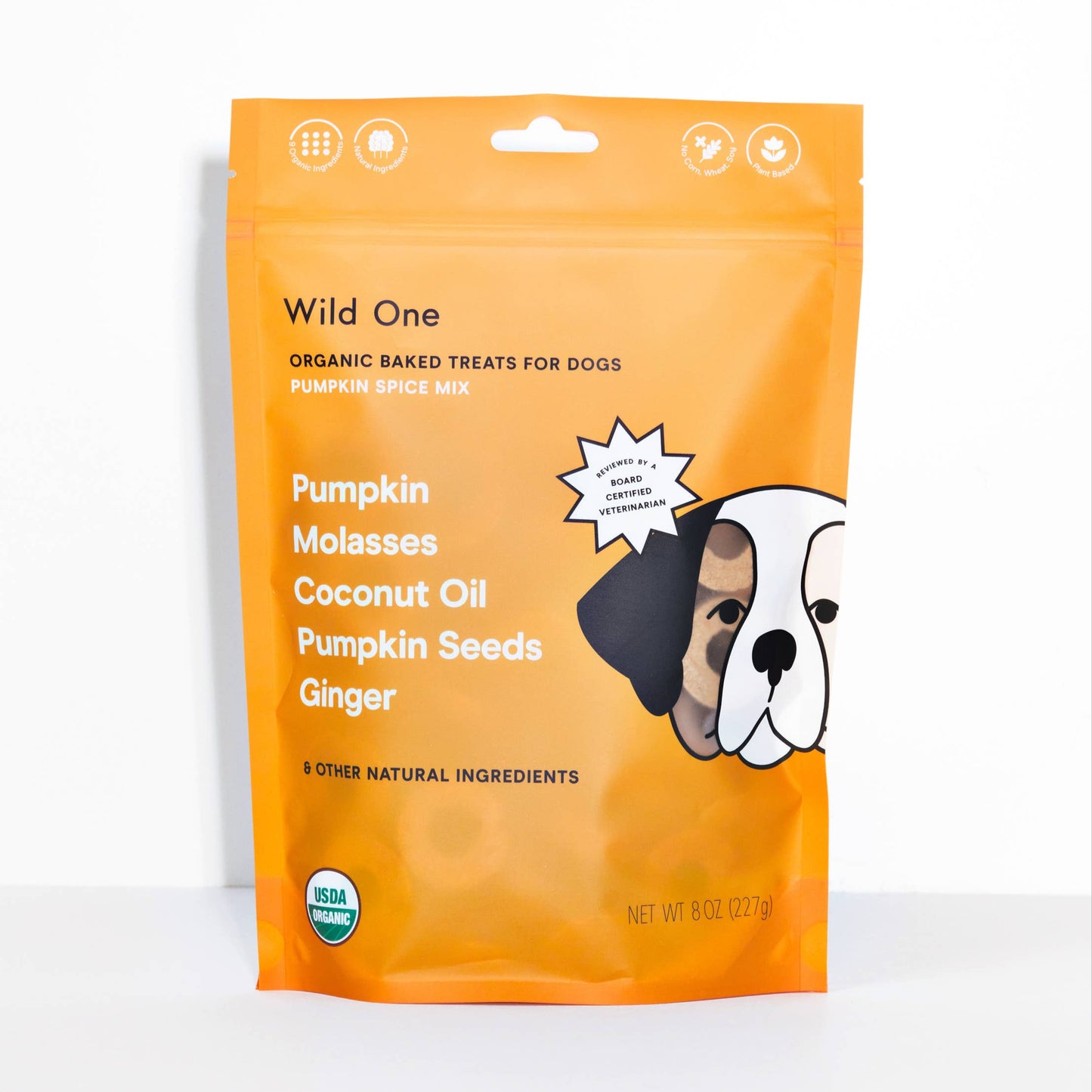 Front packaging of Wild One organic pumpkin spice vegan dog treats made with certified USDA organic ingredients and no corn, wheat, soy, or artificial fillers.