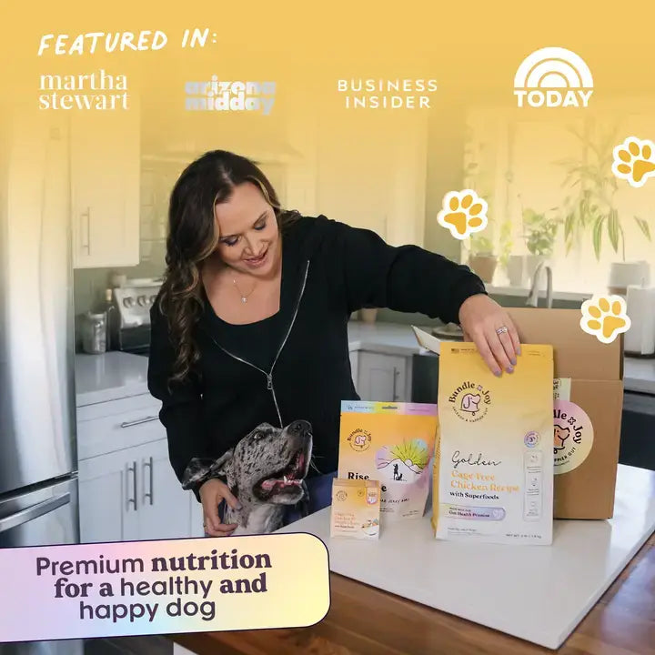 Owner and dog at table with Bundle x Joy Golden Cage-Free Chicken Recipe bag visible