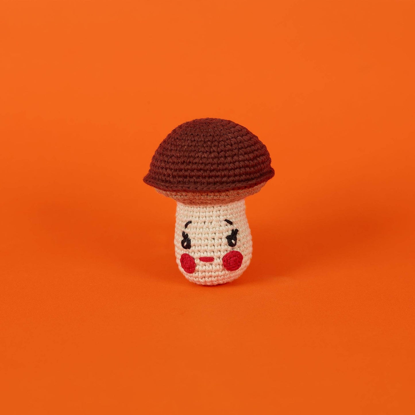 Natural cotton mushroom dog toy made with all-natural dyes and a built-in squeaker