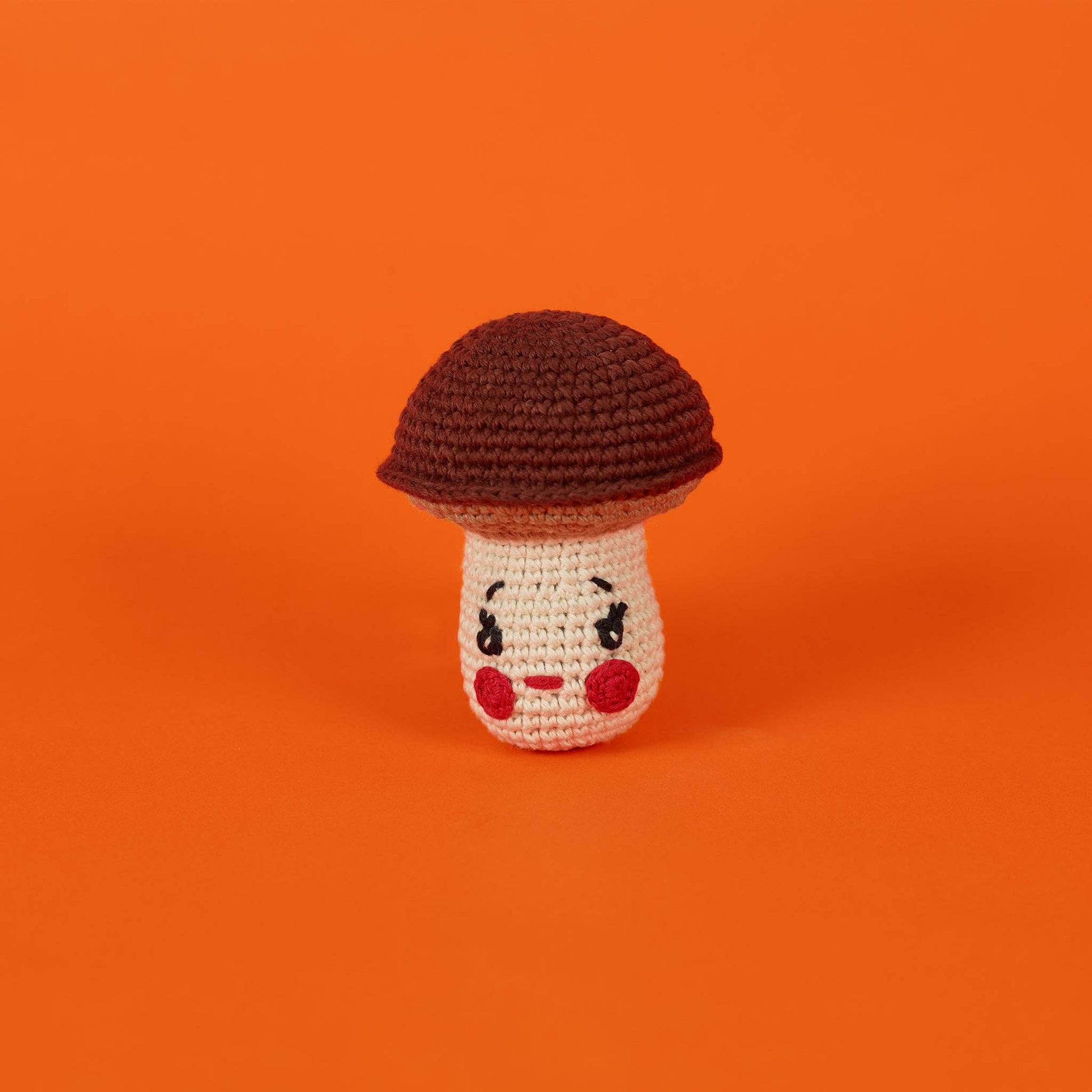 Natural cotton mushroom dog toy made with all-natural dyes and a built-in squeaker