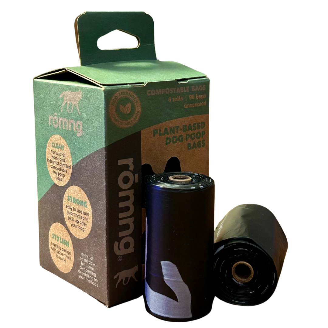 rōmng compostable biodegradable dog poop bags with plant-based packaging and rolls shown.