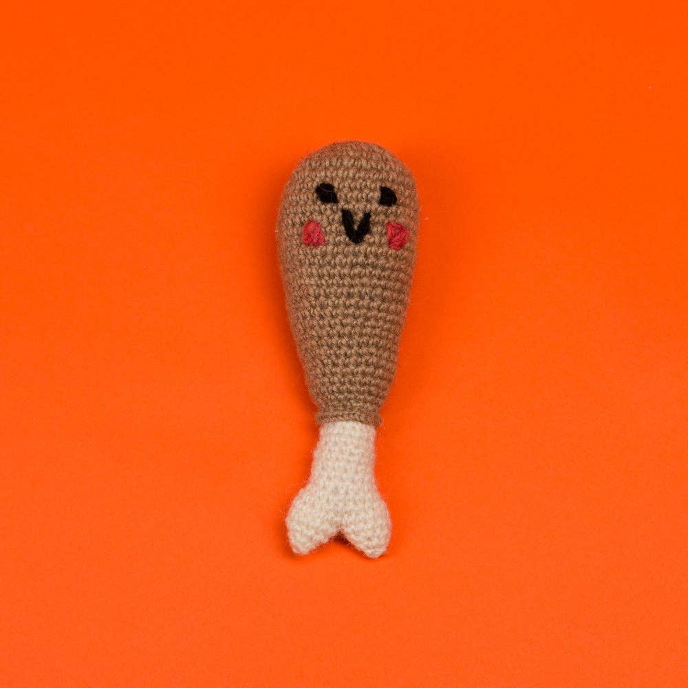 Drumstick-shaped dog toy by Ware of the Dog, designed for playful pups. Made with durable, non-toxic materials, perfect for chewing, fetching, or tugging. Adds a touch of fun and whimsy to your dog's playtime.