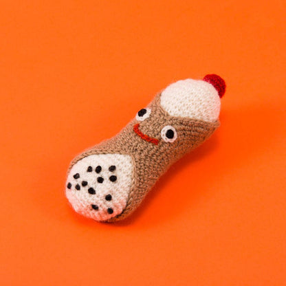 Lambswool cannoli dog toy made from 100% lambswool and all-natural dyes, crafted for safe, non-toxic, and gentle everyday play.
