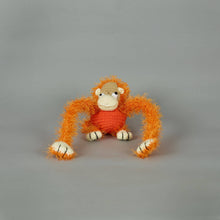 Organic cotton monkey dog toy handcrafted with non-shedding polyester yarn, eco-friendly and gentle for dogs.