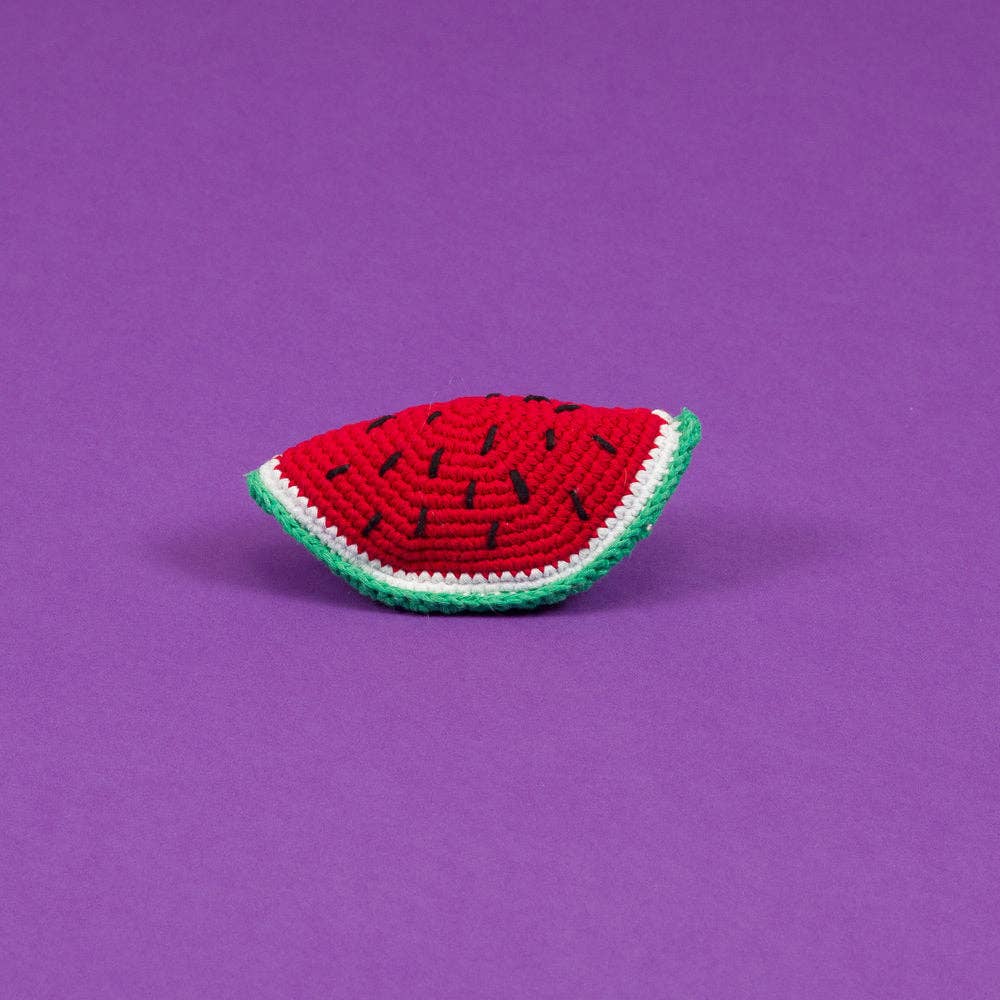 Ware of the Dog organic cotton watermelon dog toy shaped like a slice of watermelon with a red center, green rind, and black seed details, made from eco-friendly materials.