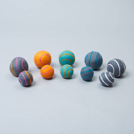 Natural wool ball dog toy made from 100% wool, designed for fetch play and handcrafted for safe, non-toxic, sustainable fun.
